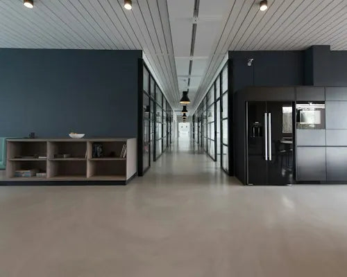 Bright office corridor with glass meeting rooms