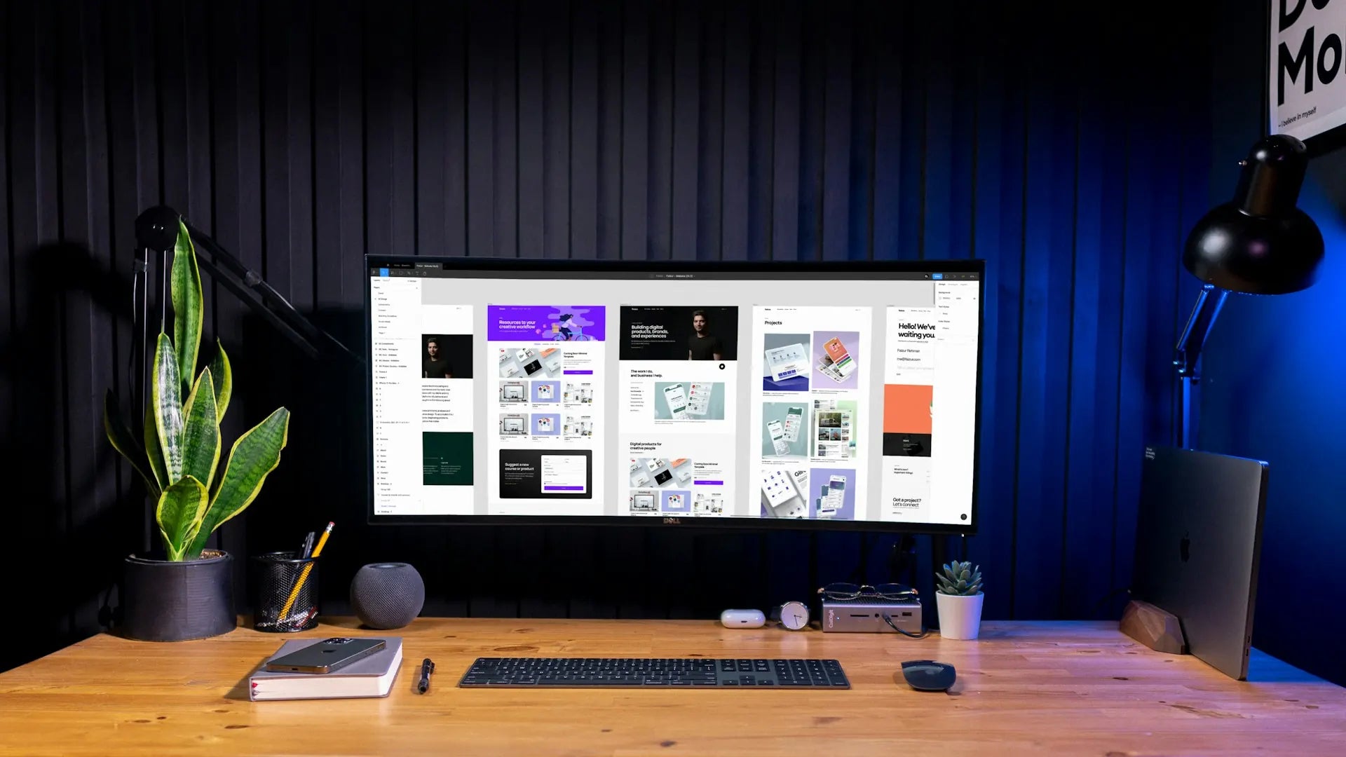 Designer's studio workspace with a Shopify store on screen